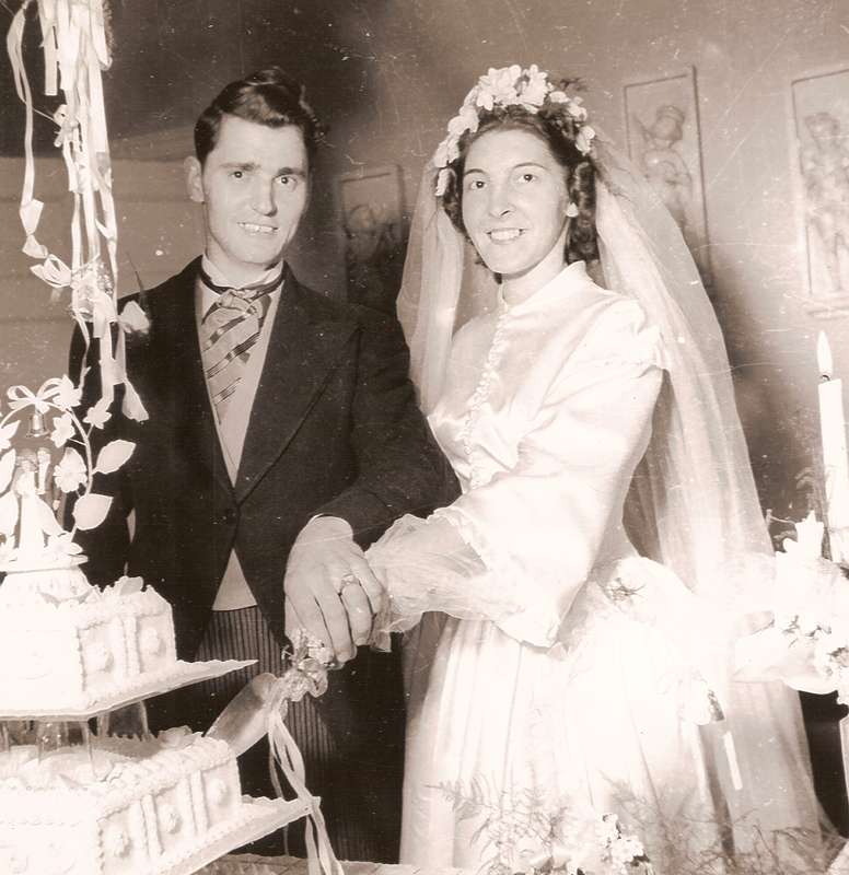 Normand And Marcelle Chartier cut the cake